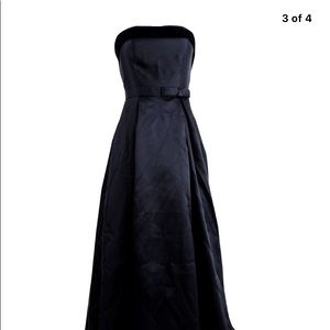 Classically timeless black strapless ball gown with velvet and satin trim. 12P